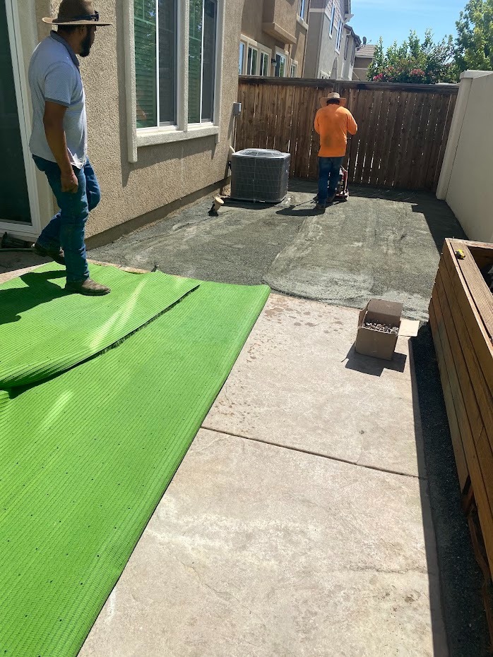 Turf being installed on a prepared site